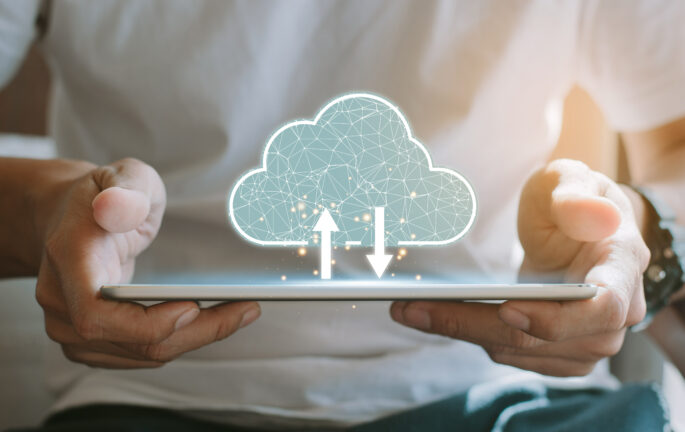 Cloud computing concept - connect devices to cloud. Young man or